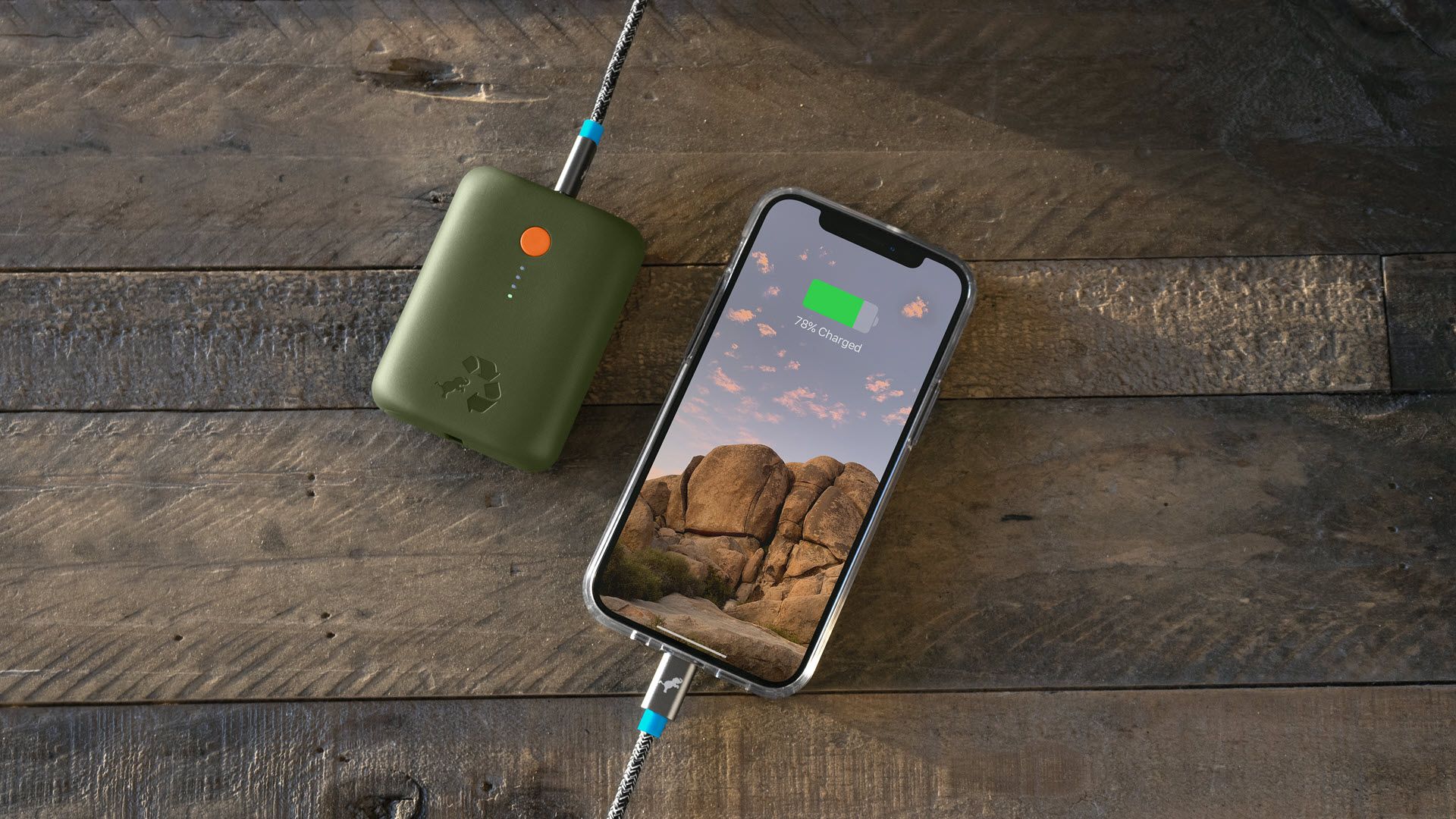 A Champ power bank plugged into an iPhone