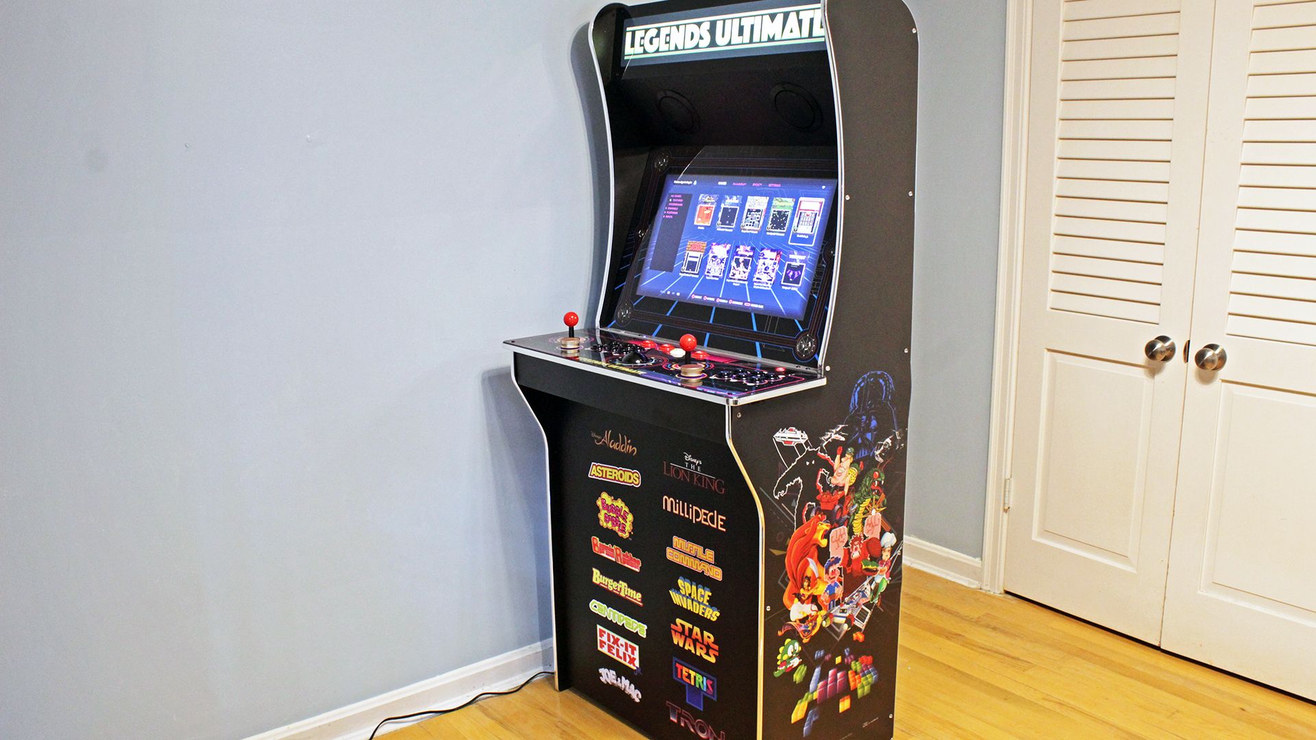 A three-quarter profile, showing artwork with various video game characters.