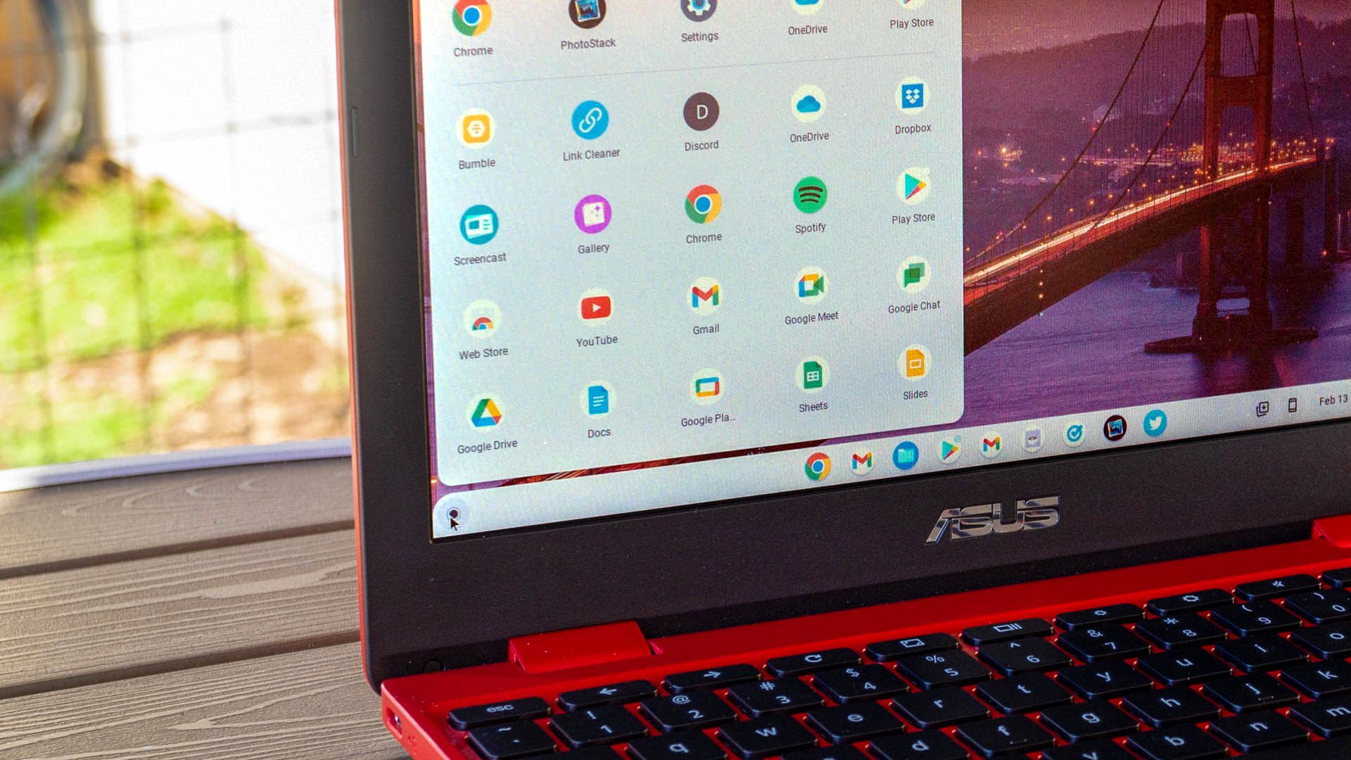 Chromebook on a table with app launcher open.