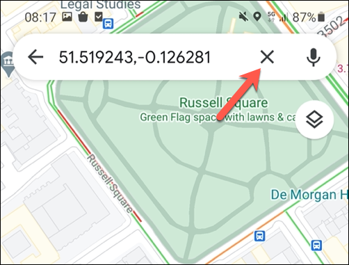 To remove a temporary pin in Google Maps, tap the cross icon on the search bar, or tap elsewhere on the map.