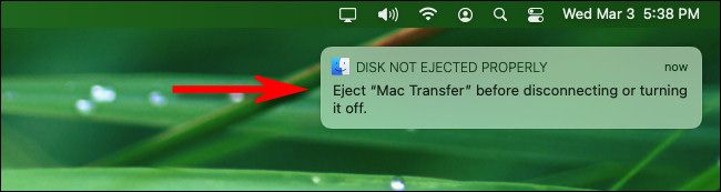 The "Disk Not Ejected Properly" warning message on macOS Big Sur.