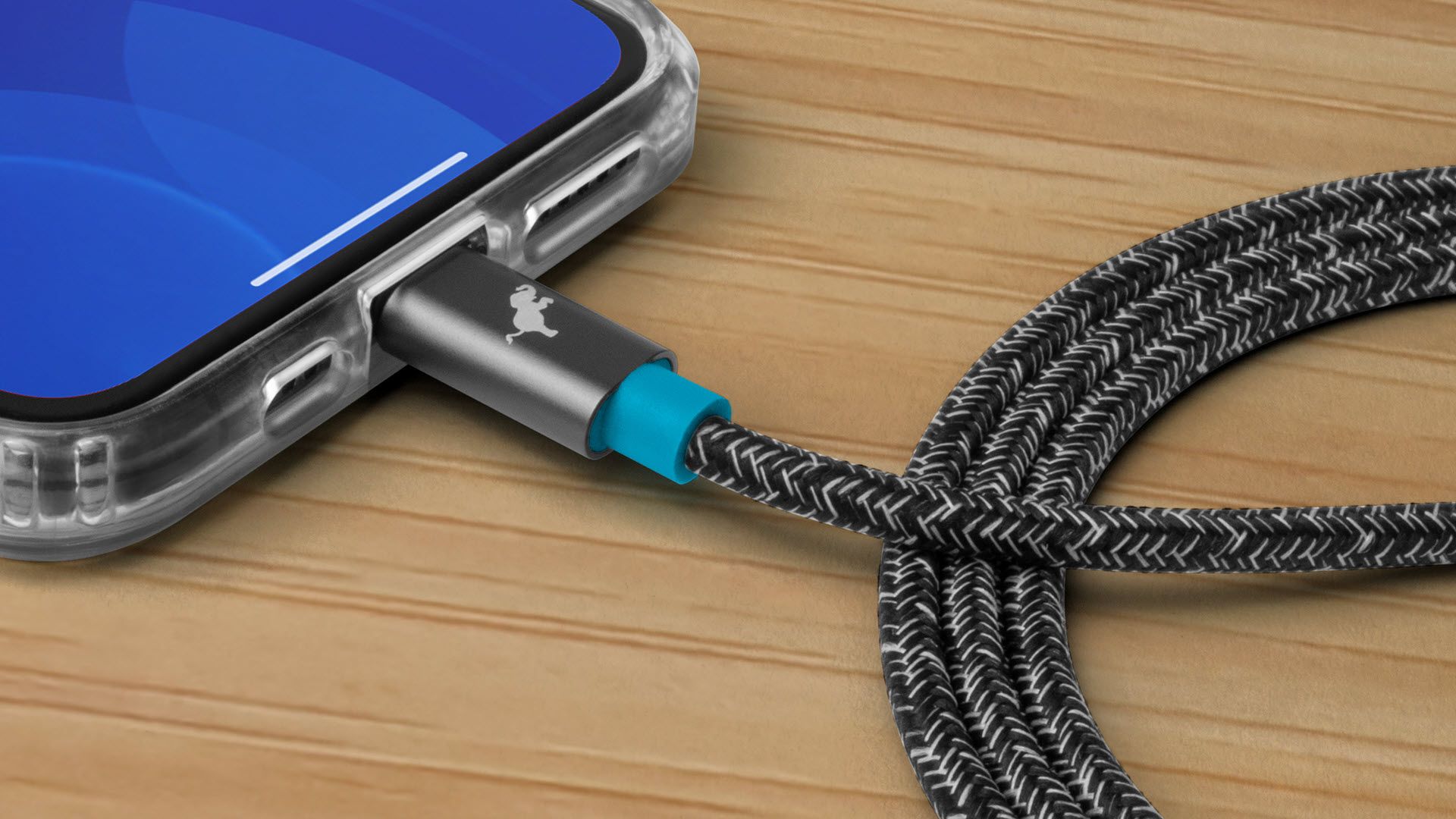 A PowerKnit cable connected to an iPhone