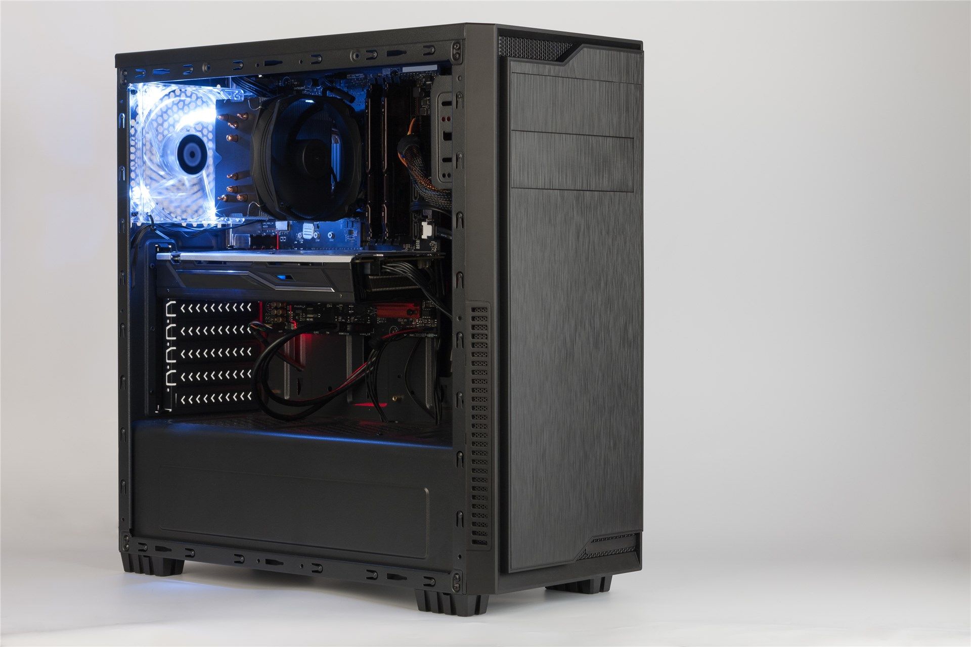 Open midi tower computer case with red and blue lighting effects on white background