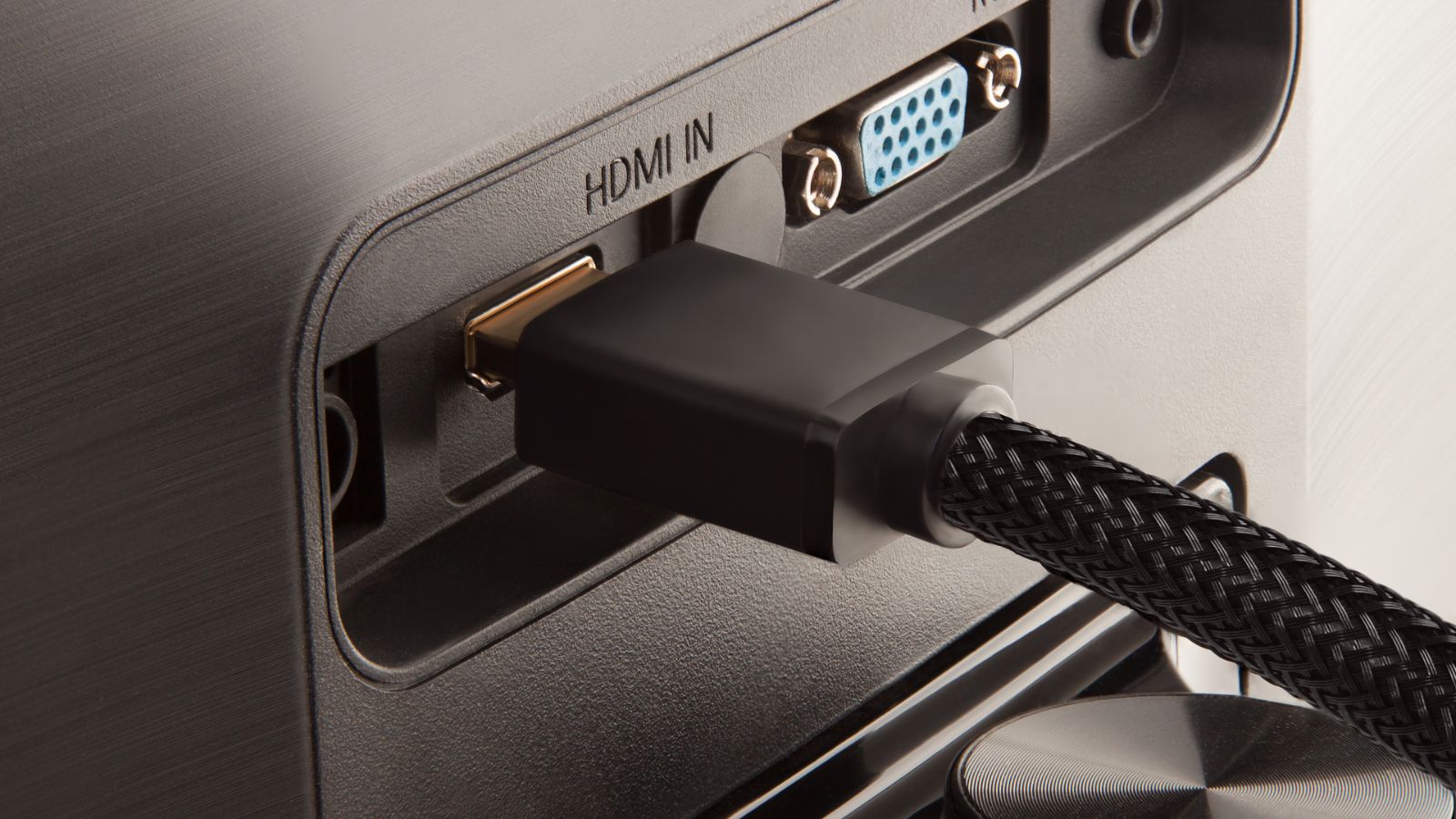 HDMI cable going into port on back of monitor