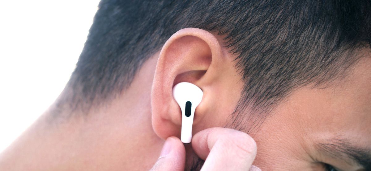 iPhone User Listening to New Incoming Messages Using AirPods Pro