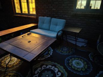 A photo of a patio at night.