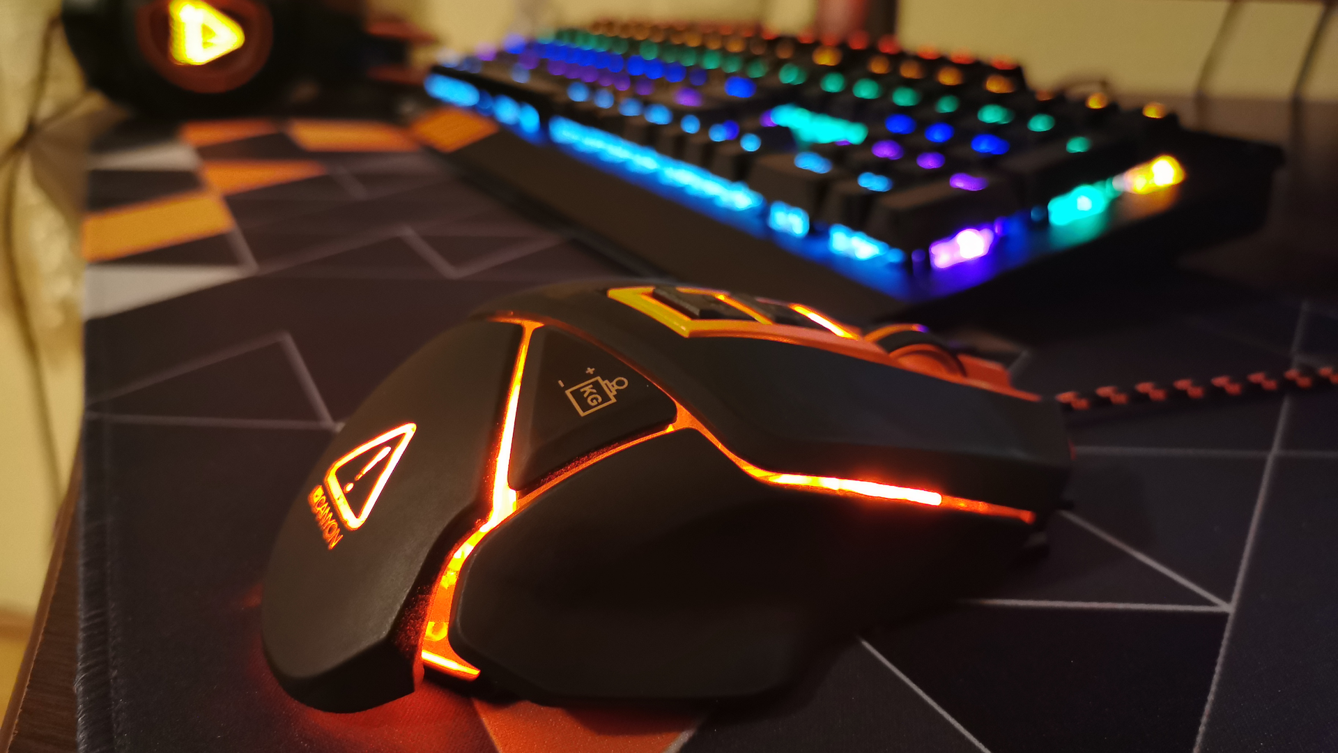 A gaming mouse and keyboard with RGB lighting.