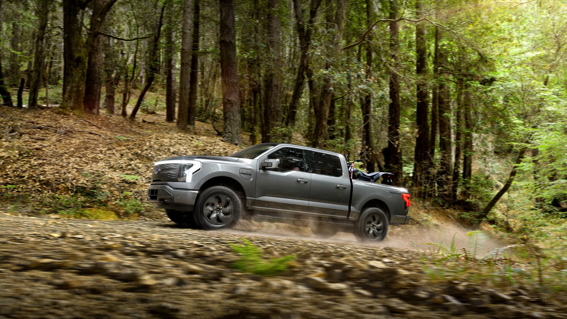 Ford F-150 Lightning driving up a hill