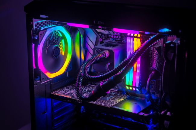 A PC case with a liquid cooling system and RGB lighting.