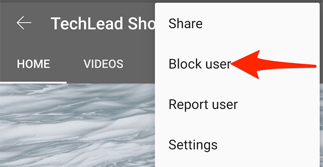 Choose "Block User" from the three-dots menu in the YouTube app.