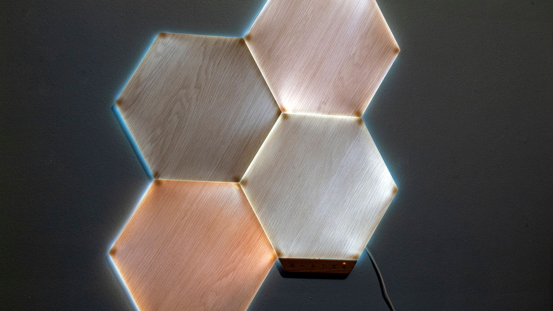 A closeup of lit woodgrain hexagon panels.