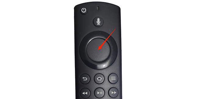 Press the button inside the ring on the Fire TV remote.