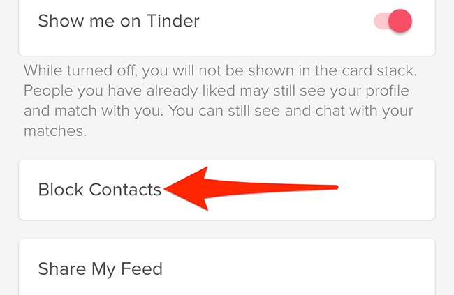 Select "Block Contacts" in Tinder's "Settings" menu.