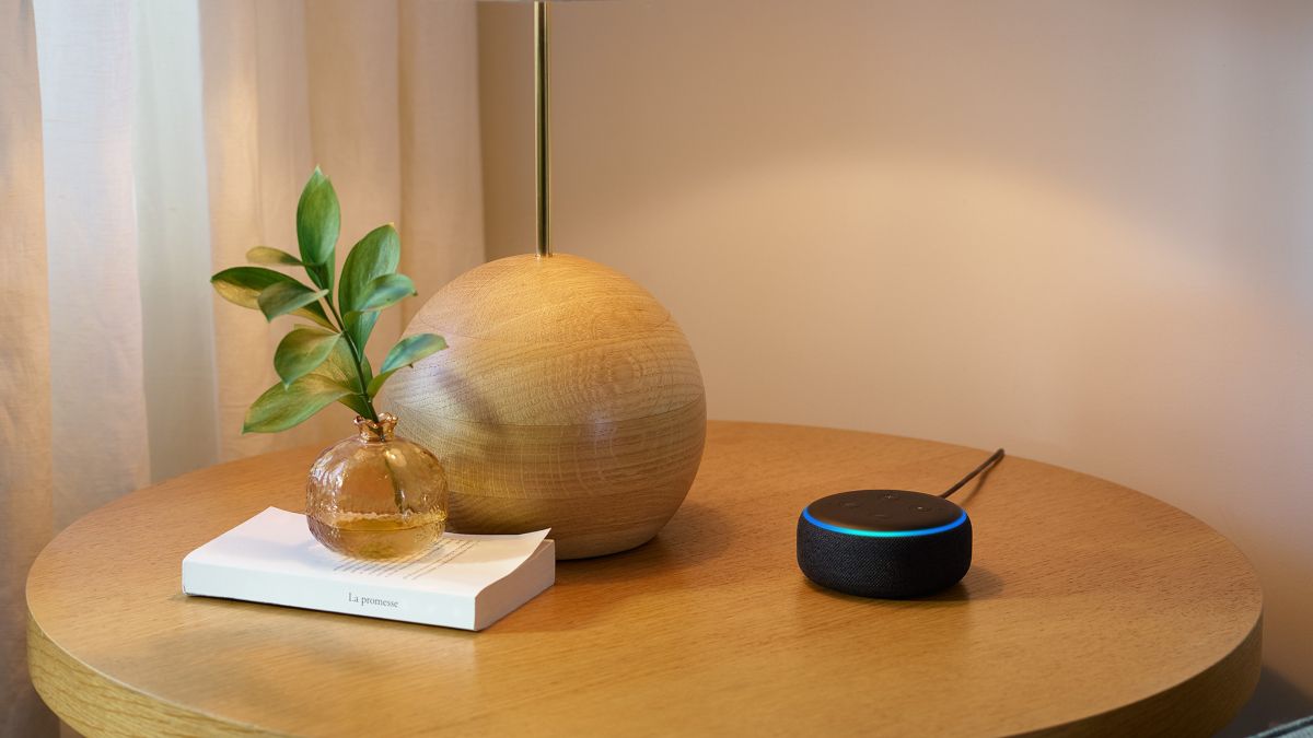 Echo Dot sitting on table.