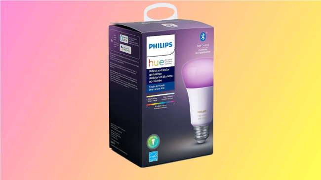 Philips hue box on a pink and yellow background.