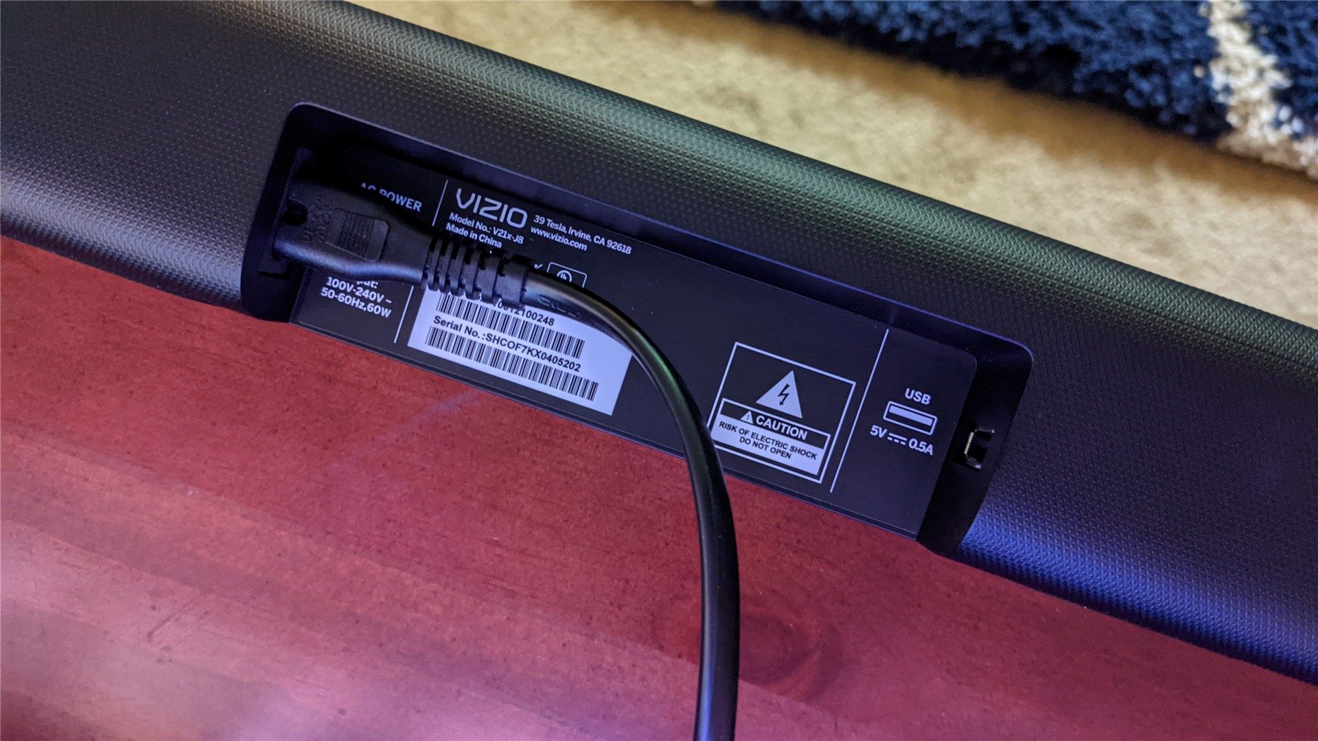 The back of the V-Series soundbar showing the power and USB connections