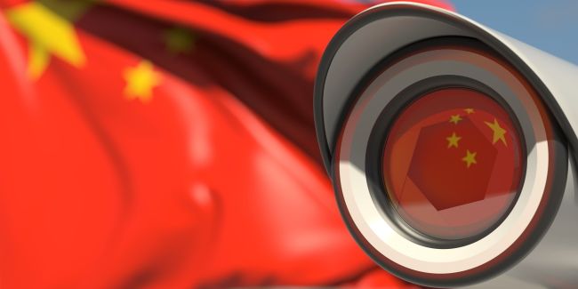 The Chinese flag reflected in a surveillance camera.