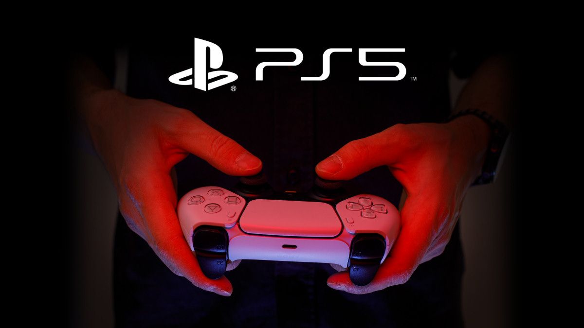 A person holding a PS5 controller.