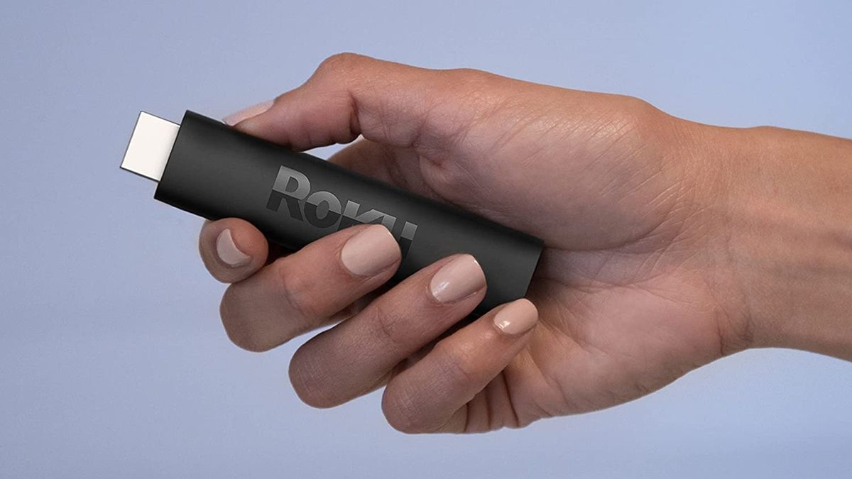 Person holding Roku streaming stick 4K