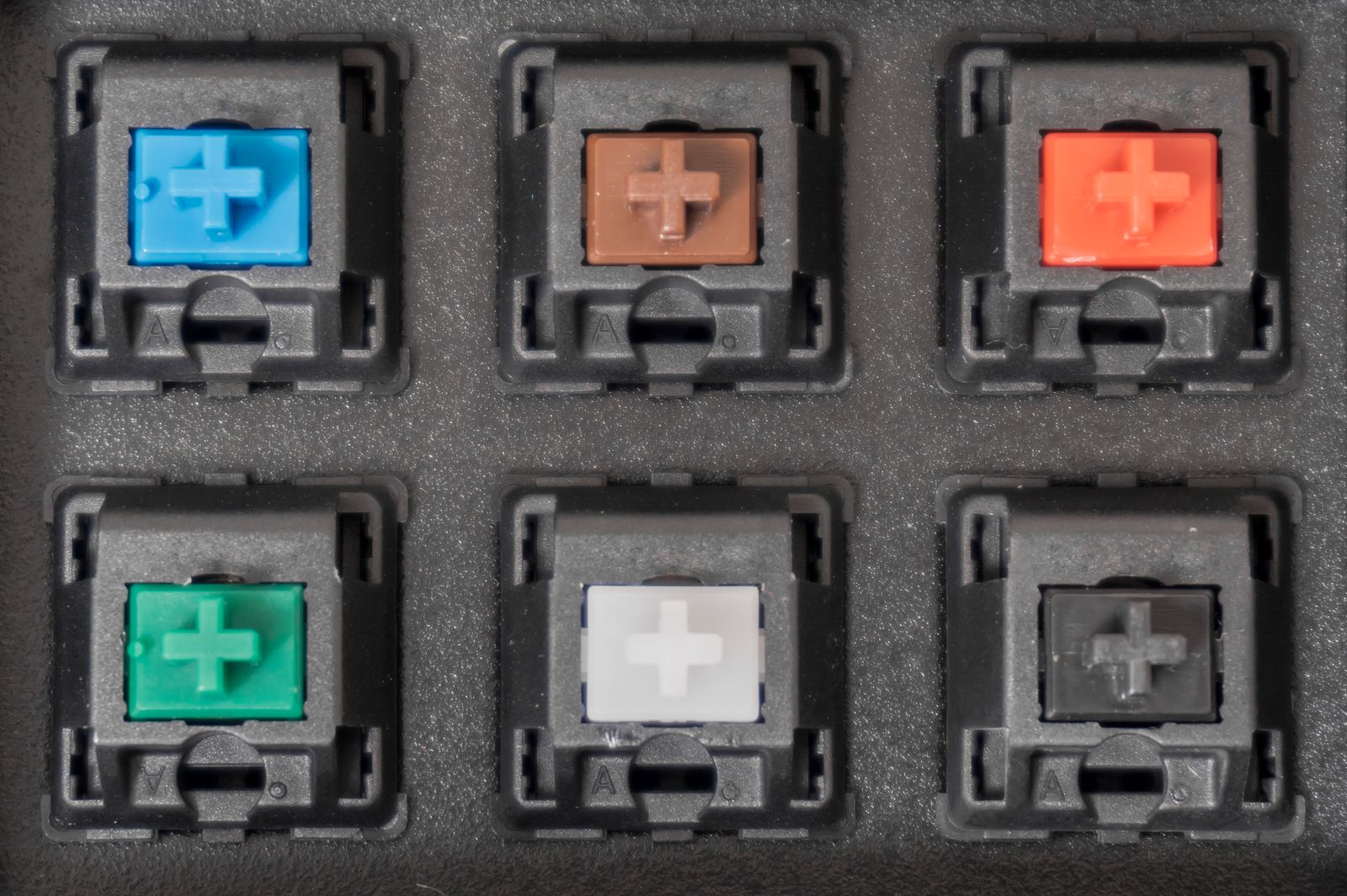 Handful of mechanical switches stored in foam display