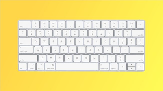 Apple Mage Keyboard on yellow background