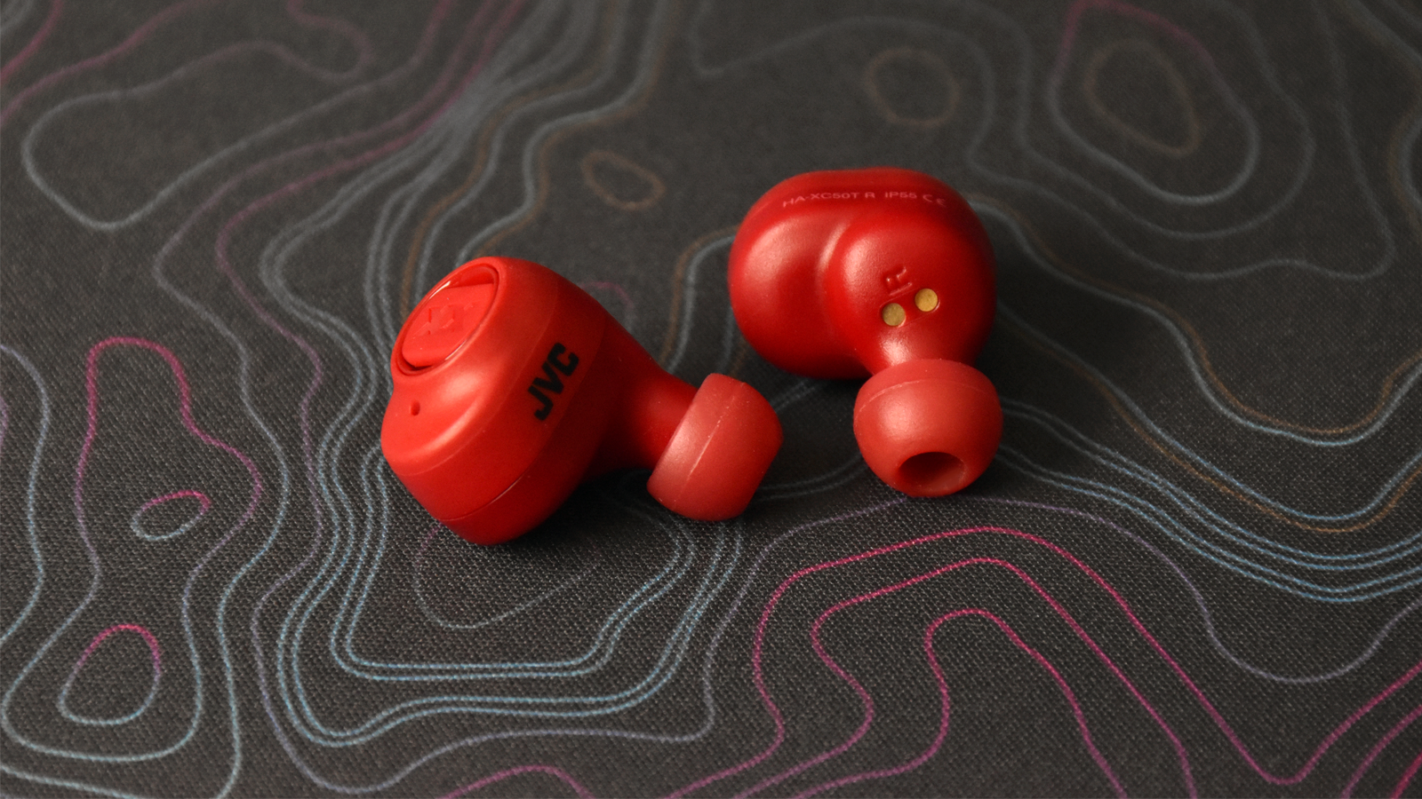 View of just the earbuds against a decorative background