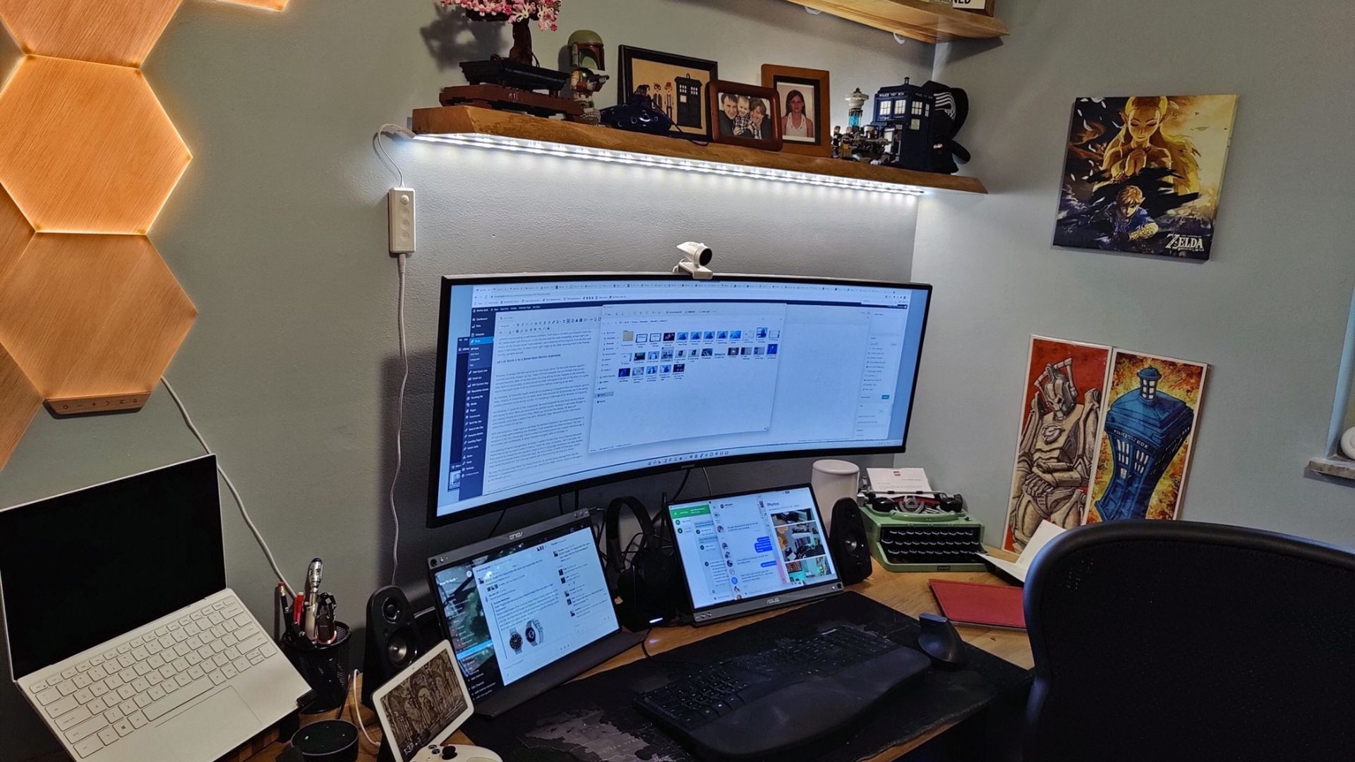 A desk with three monitors and many windows open.
