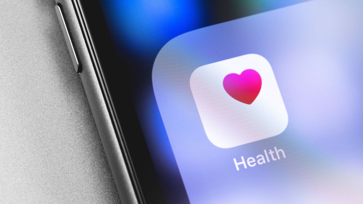 Apple Health app icon in the corner of an Apple iPhone
