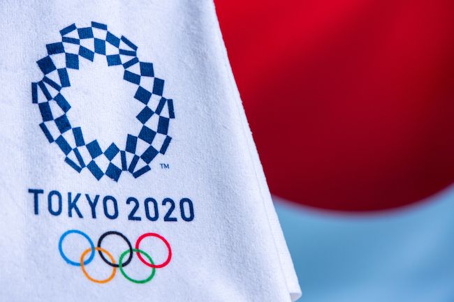 Tokyo 2020 logo on an Olympic flag