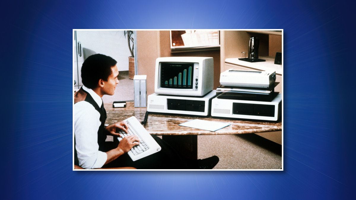 A man using an IBM PC 5150
