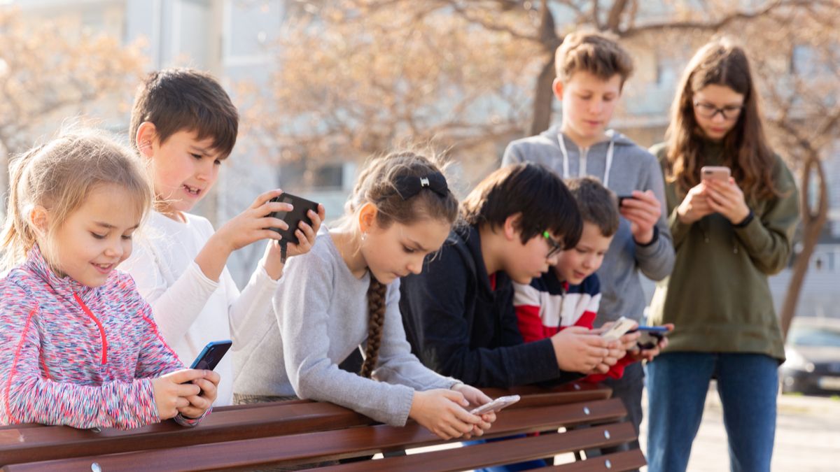 Kids using phones.