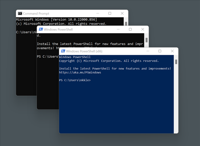 Command Prompt and PowerShell windows open on a grey background.