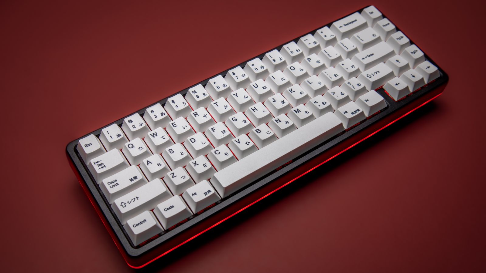 65% mechanical keyboard on red backdrop