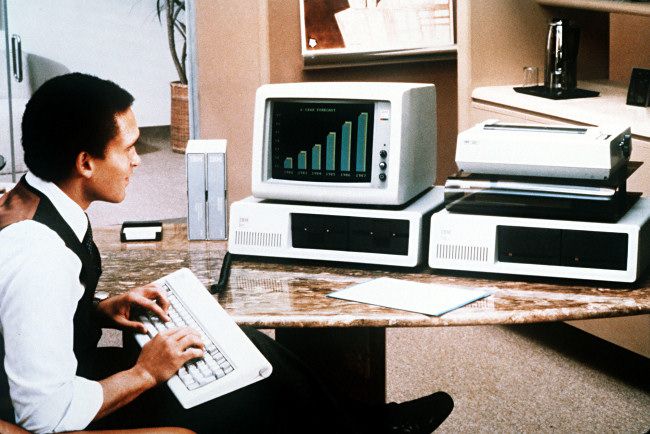 A man using an IBM PC in 1981.