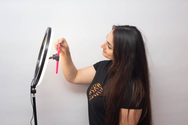 Woman taking a selfie with a ring light