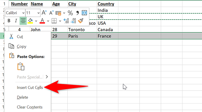 Right-click the target row's number and select "Insert Cut Cells" in Excel.