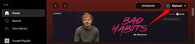 Click the user name at the top of Spotify on desktop.
