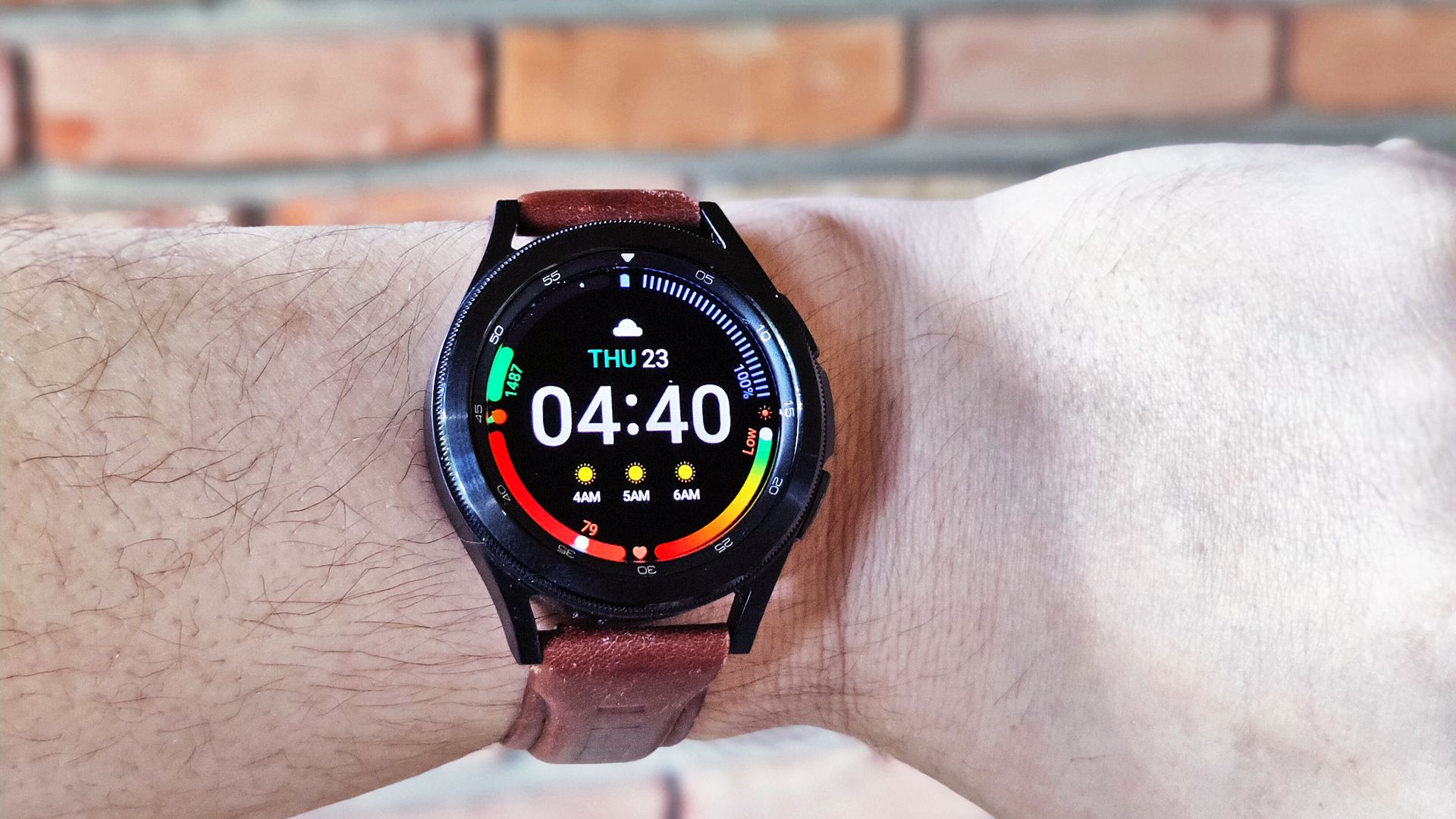 A closeup of the Galaxy Watch 4 with a leather band.