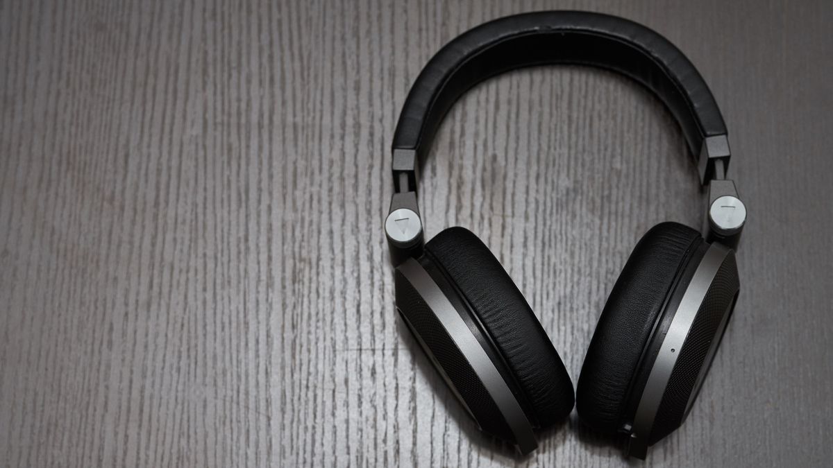 Headphones on wood background