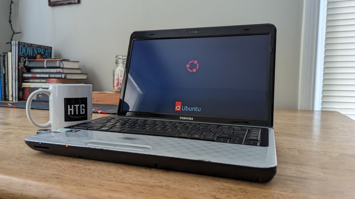 A laptop running Linux sitting on a table.