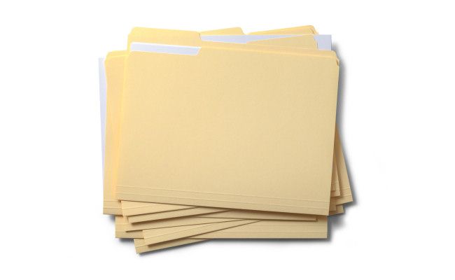 A stack of manila folders