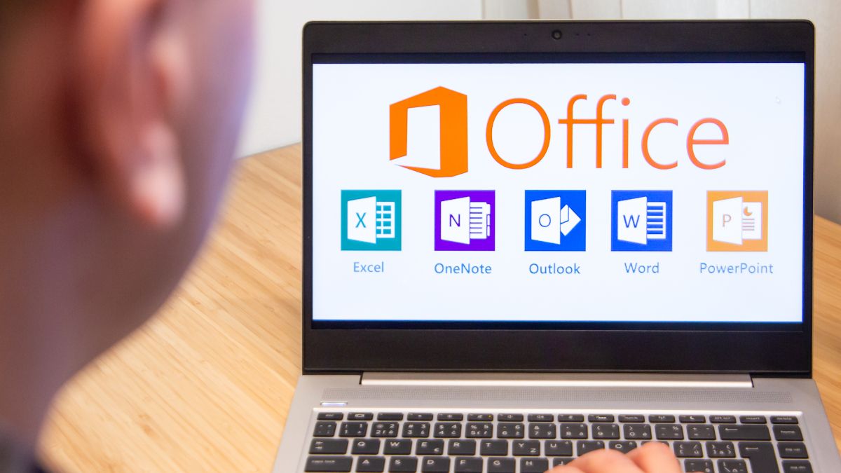 Laptop showing Microsoft Office logos