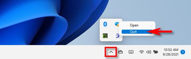 Click the carat arrow in the taskbar, then right-click the Teams icon and select "Quit."