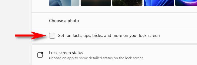 Uncheck "Get fun facts, tips, tricks, and more on your lock screen."