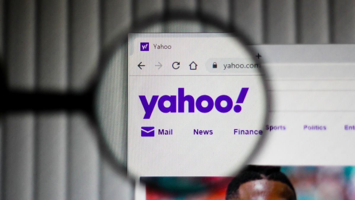 Yahoo logo in website header inside a magnifying glass
