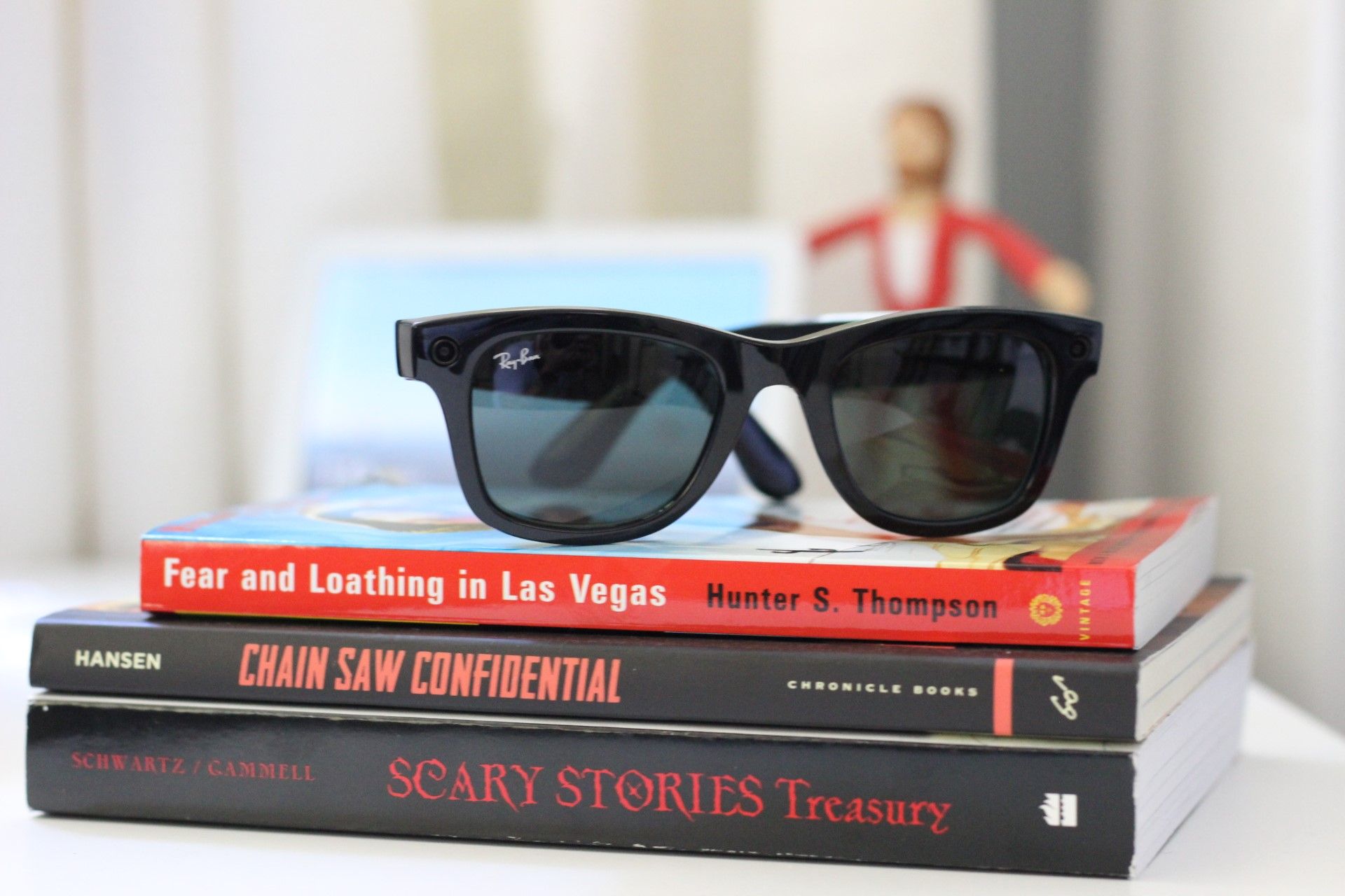 The Ray-Ban Stories on top of a stack of books