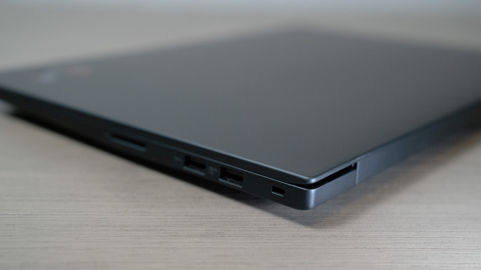 The back left corner of the Lenovo Gen 4 laptop with the lid closed