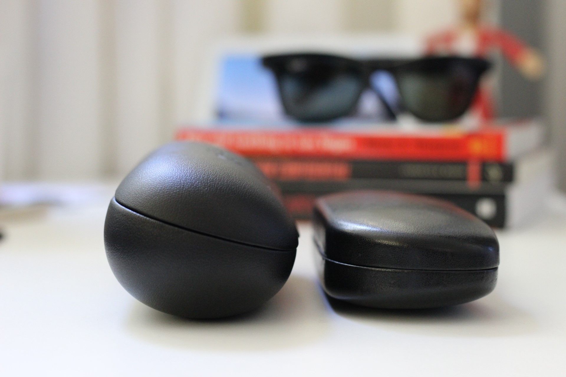 The Ray-Ban Stories case next to a regular glasses case