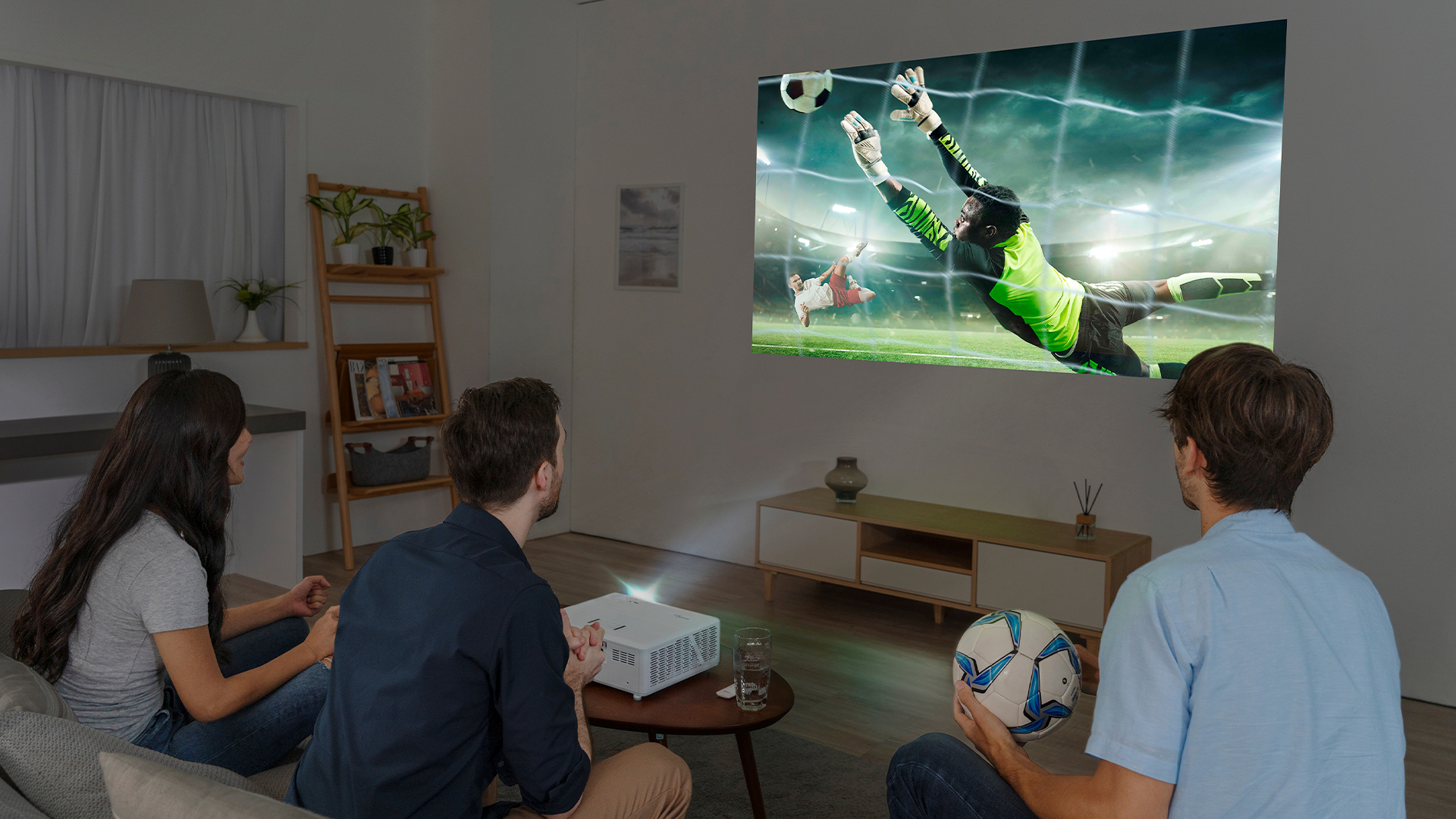 A group of friends enjoying the Optoma UHZ50 short throw projector.