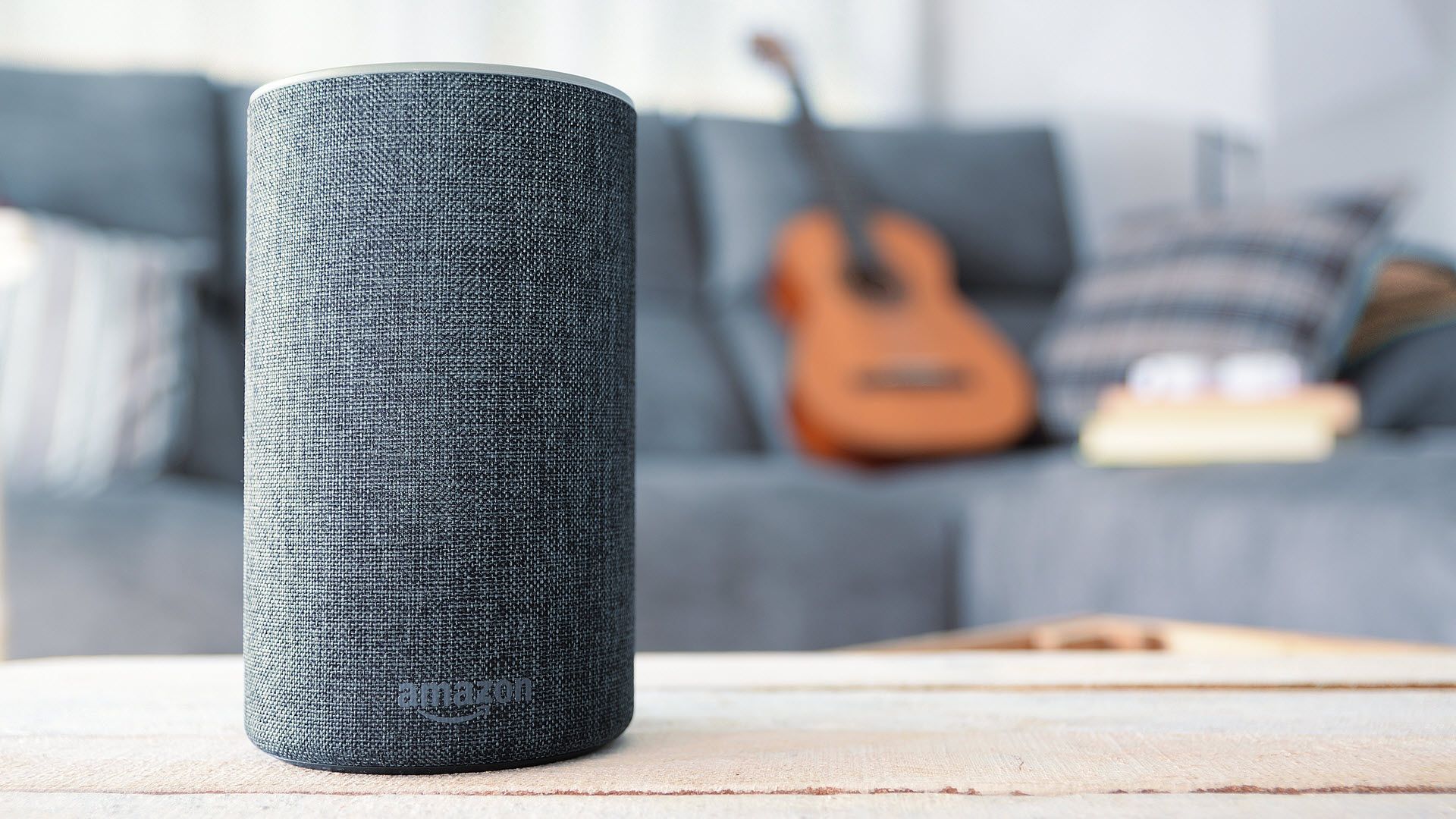 An Amazon Echo on a living room coffee table.